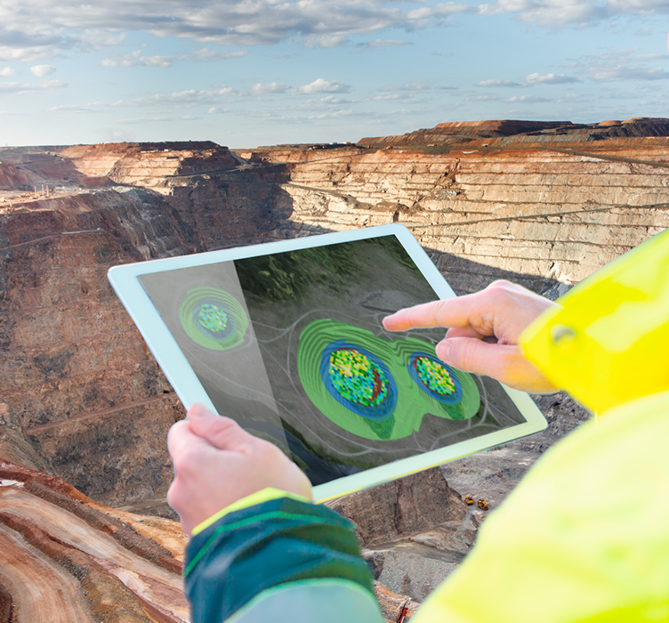 Person using tablet with mine in background